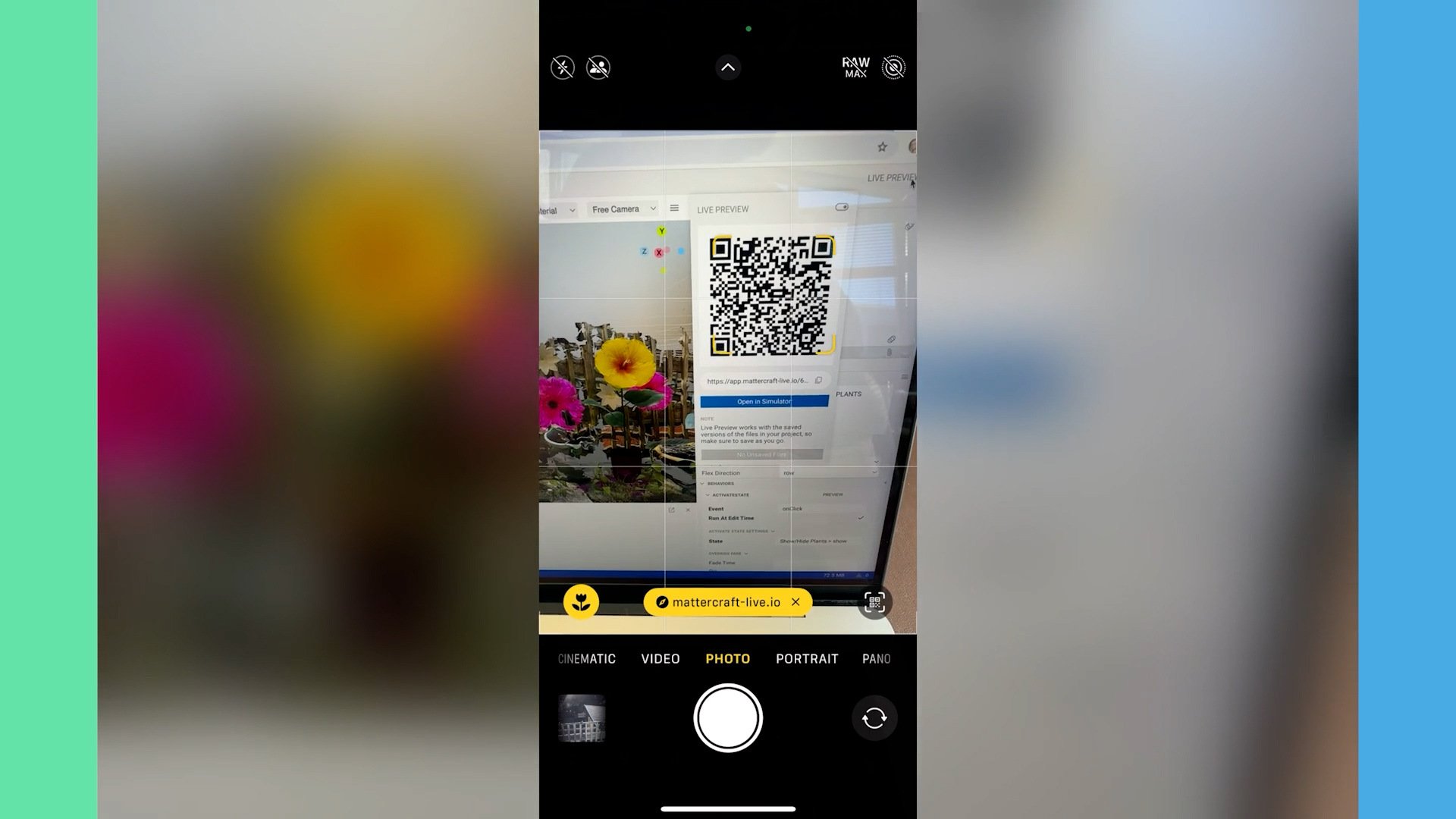 A smartphone camera scanning a QR code on a computer screen, linking to an AR garden preview in Mattercraft.